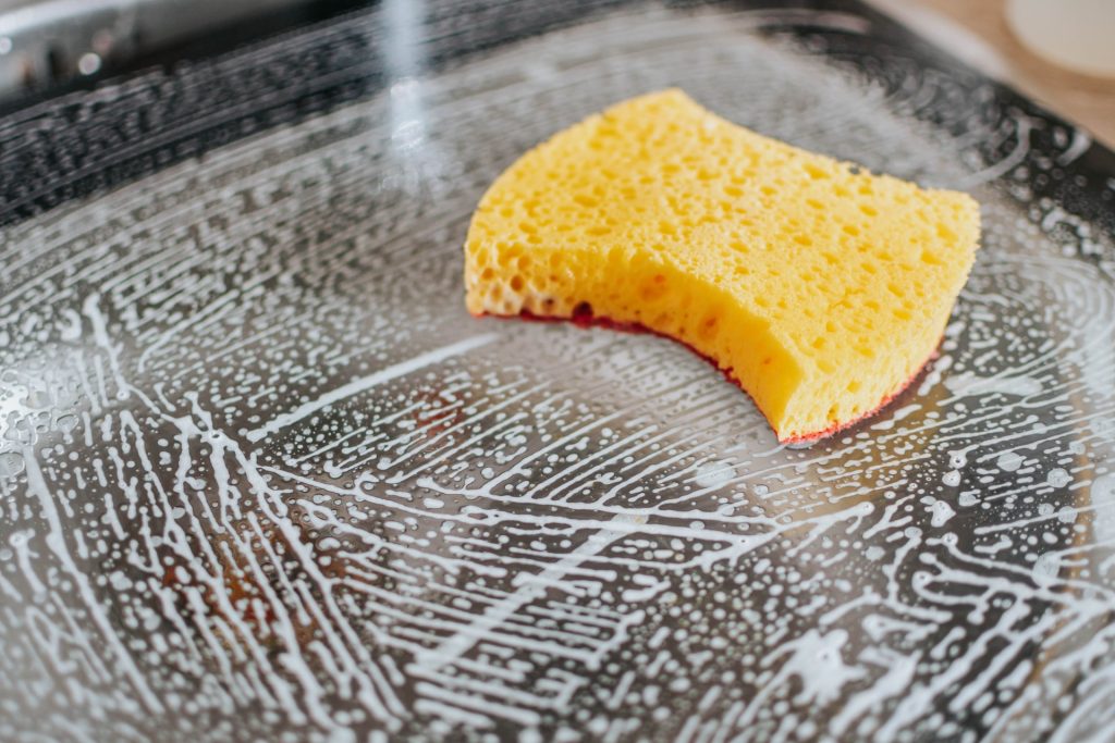 Kitchen sponge and foam on the sink